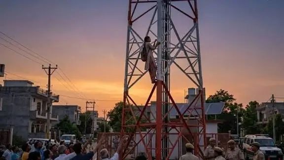 Girl Climbs Mobile Tower